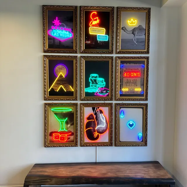 Nine-piece High Stakes Collection of gold-framed Las Vegas LED neon artworks arranged in a grid