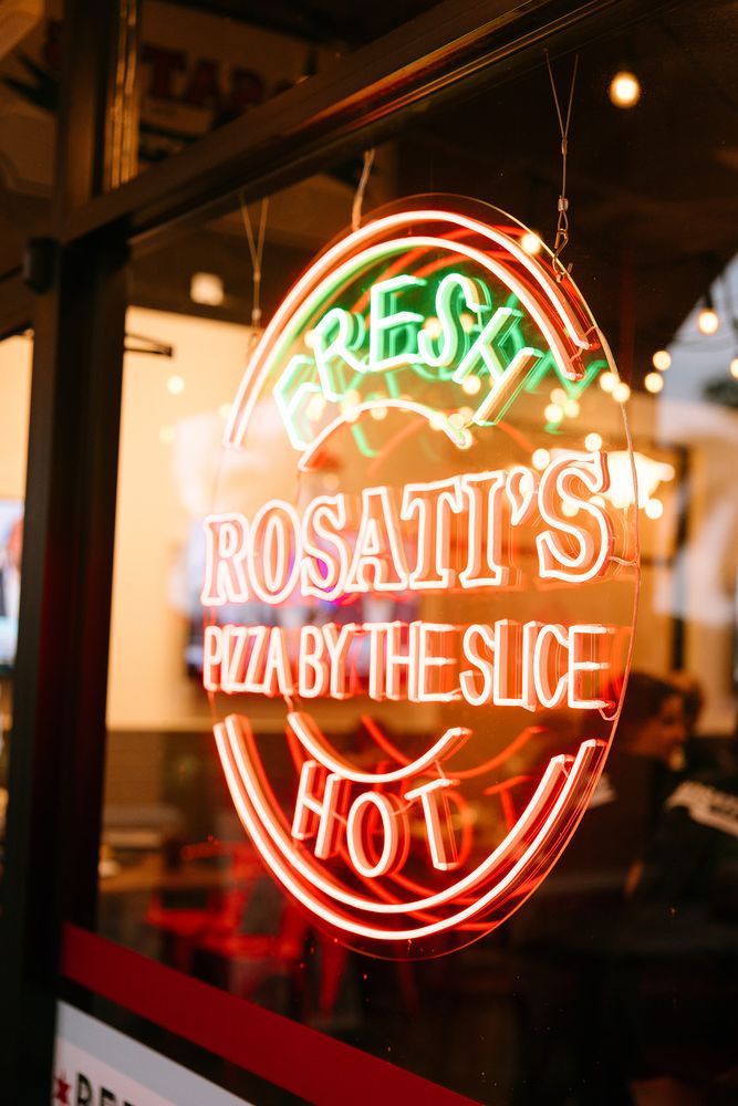 Rosati's Pizza LED neon logo sign in a storefront window