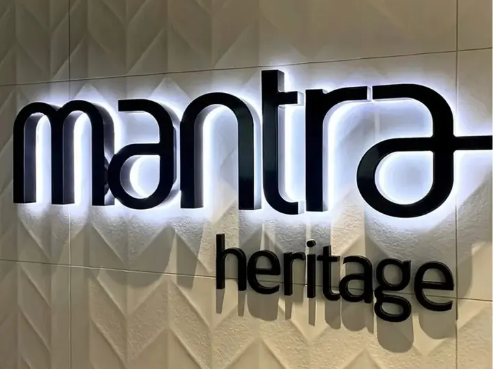 Mantra Heritage halo-lit reverse channel letters on a textured tile wall