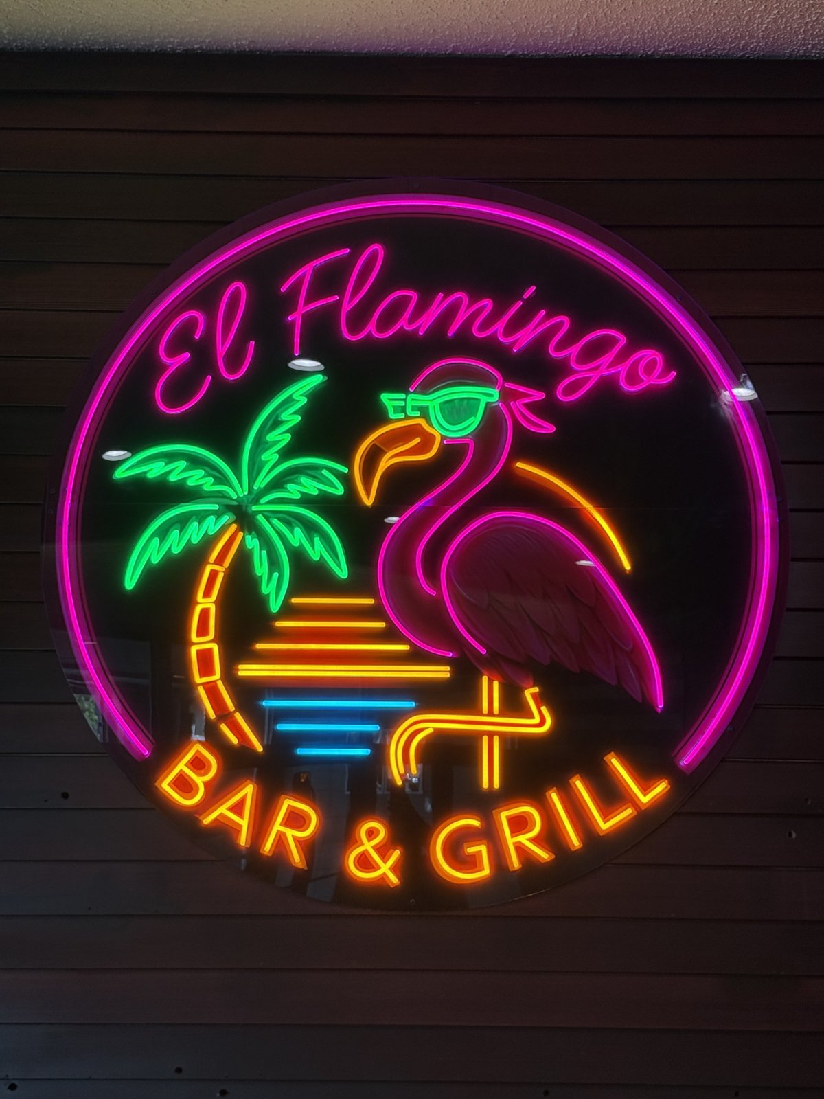 El Flamingo Bar & Grill circular LED neon logo on clear acrylic
