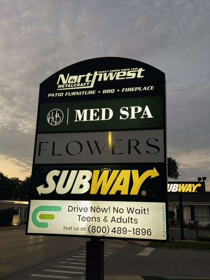 HB Med Spa illuminated panel face on a multi-tenant monument sign